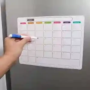 "Clear magnetic refrigerator calendar paired with vibrant neon dry erase markers and accessories."